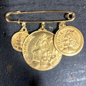 Vintage Coco Chanel 3 coin pin.